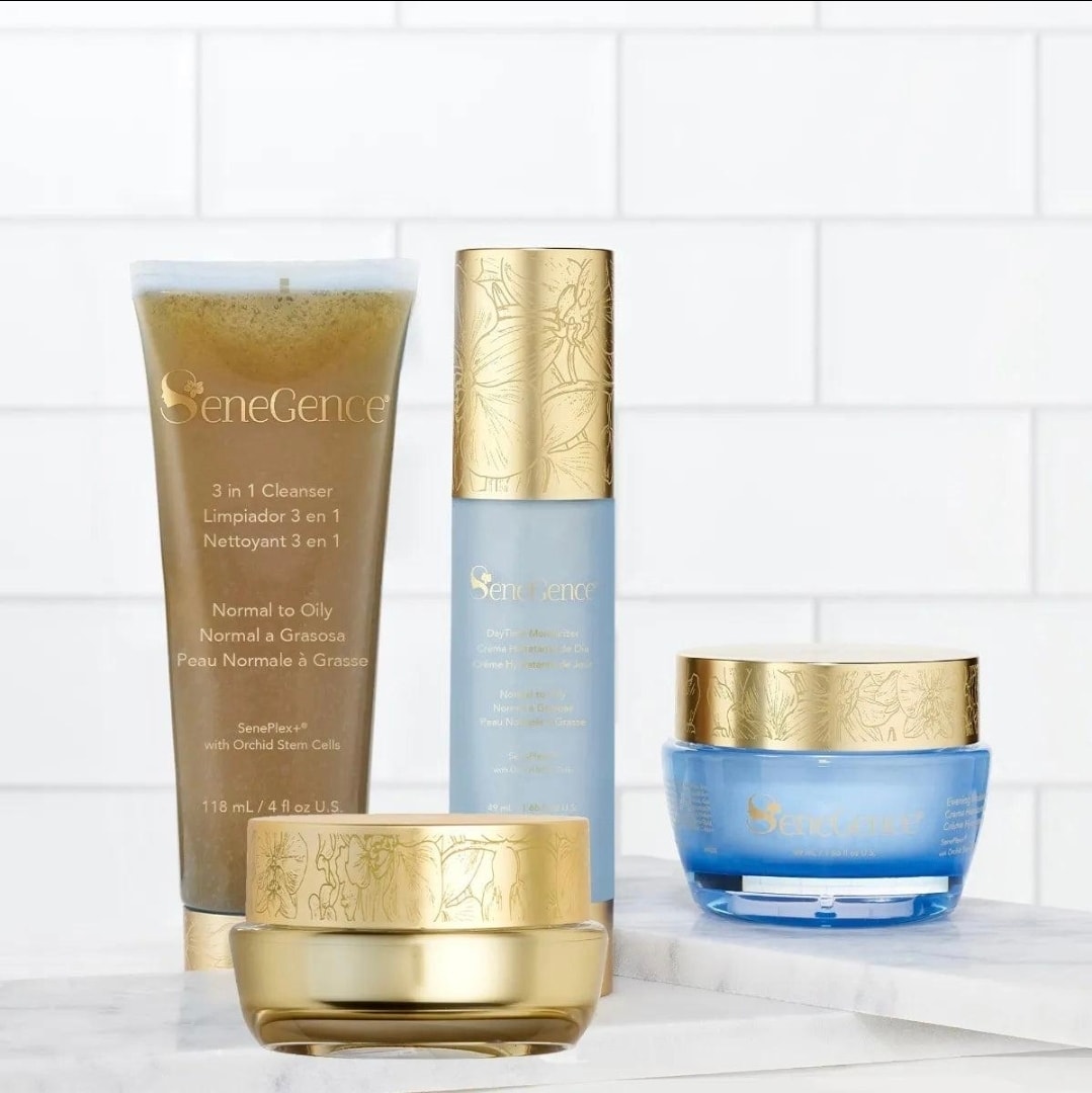 SeneGence skincare products in gold floral packaging